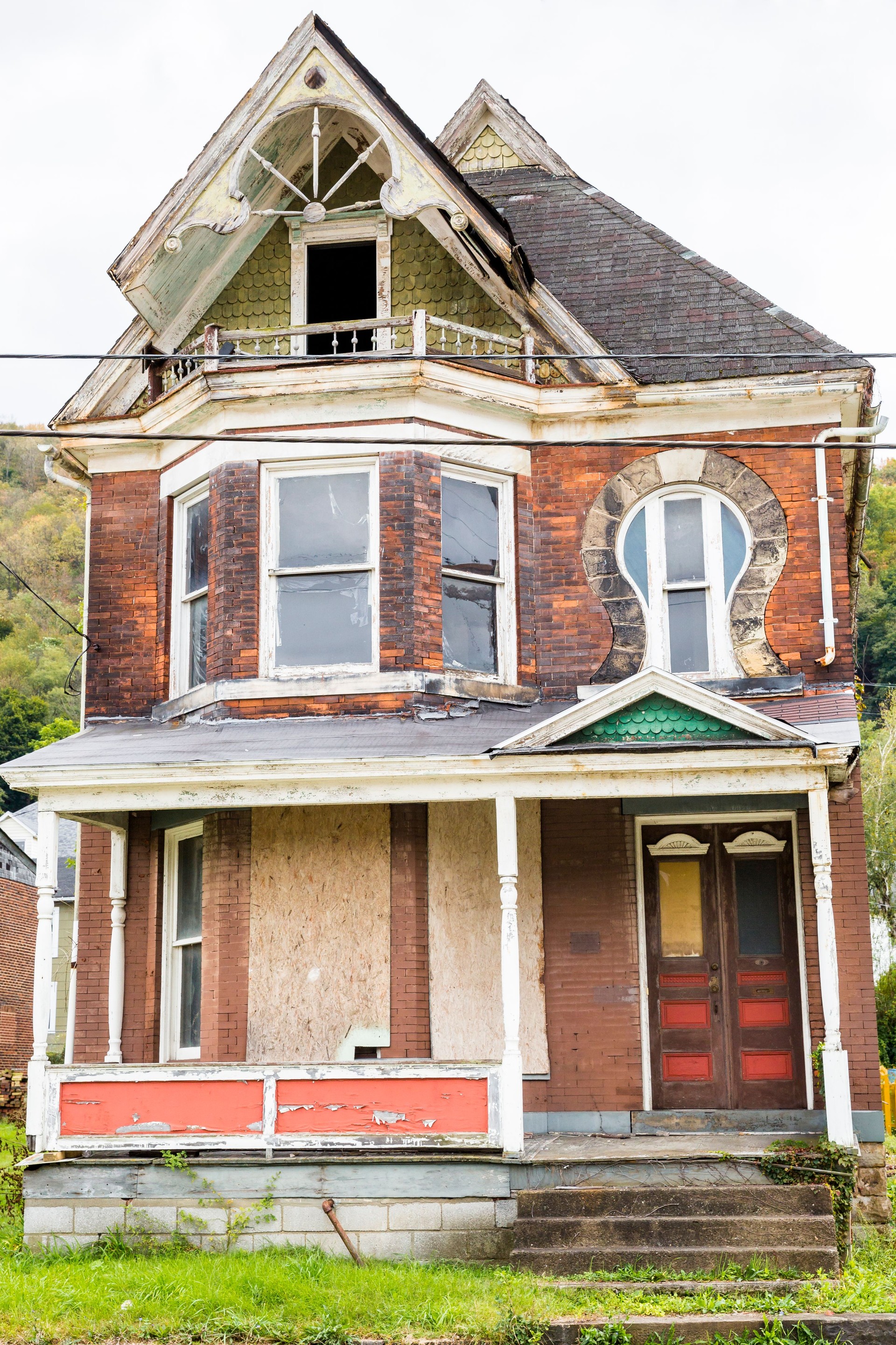 Old, Run-down Boarded Up Victorian House